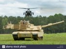 a-us-army-m1-abrams-main-battle-tank-and-a-ah-64-attack-helicopter-KCEYXT.jpg