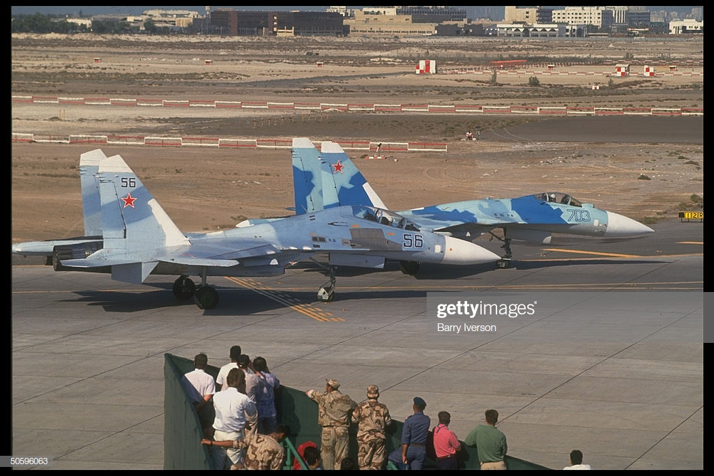 prob-russianmade-sukhoi-jet-fighter-planes-on-tarmac-among-mil-arms-picture-id50596063
