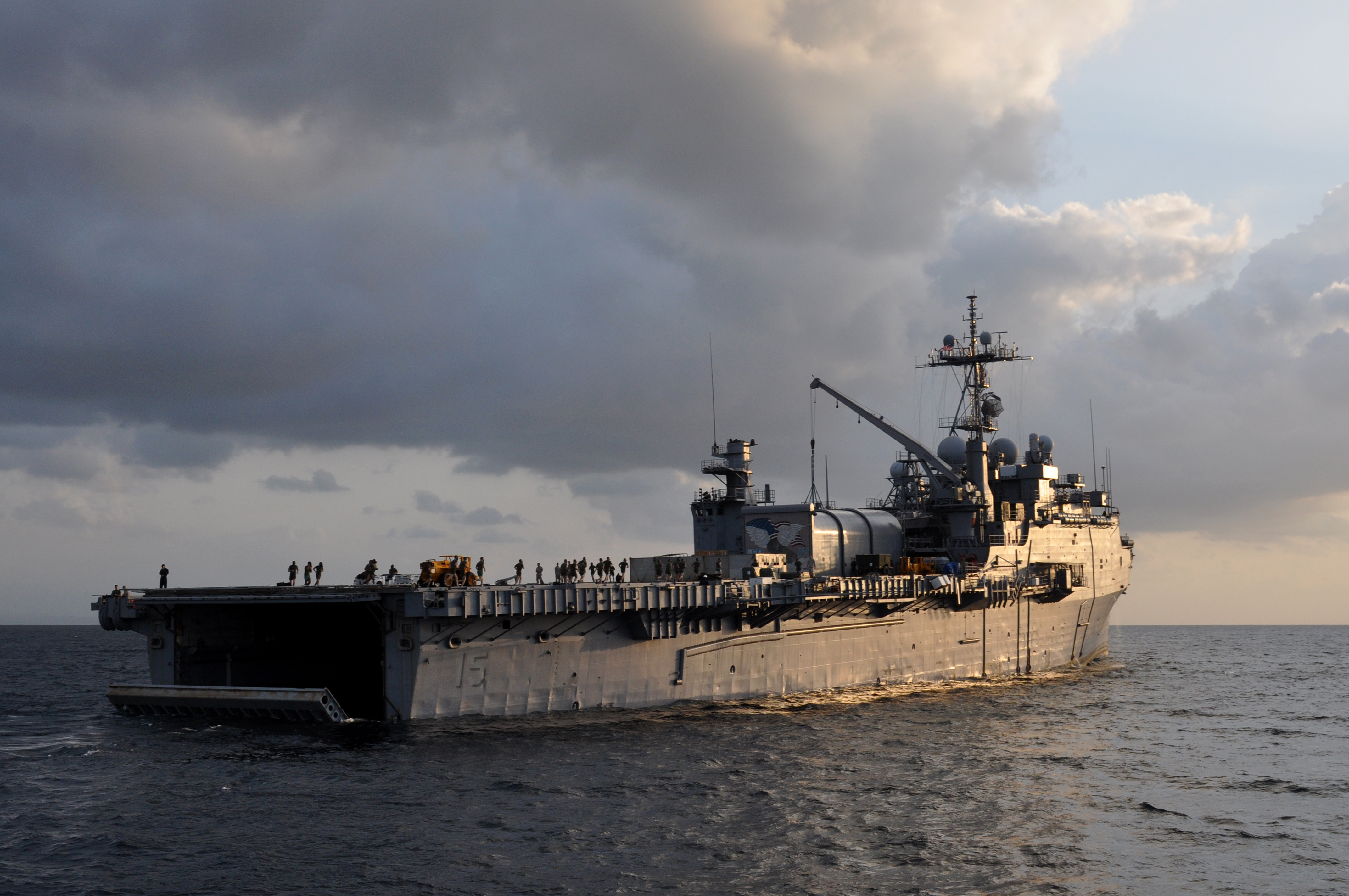 US_Navy_101029-N-7293M-083_The_amphibious_transport_dock_ship_USS_Ponce_%28LPD_15%29_is_lit_by_the_early_morning_sun_as_the_stern_gate_is_raised_after.jpg