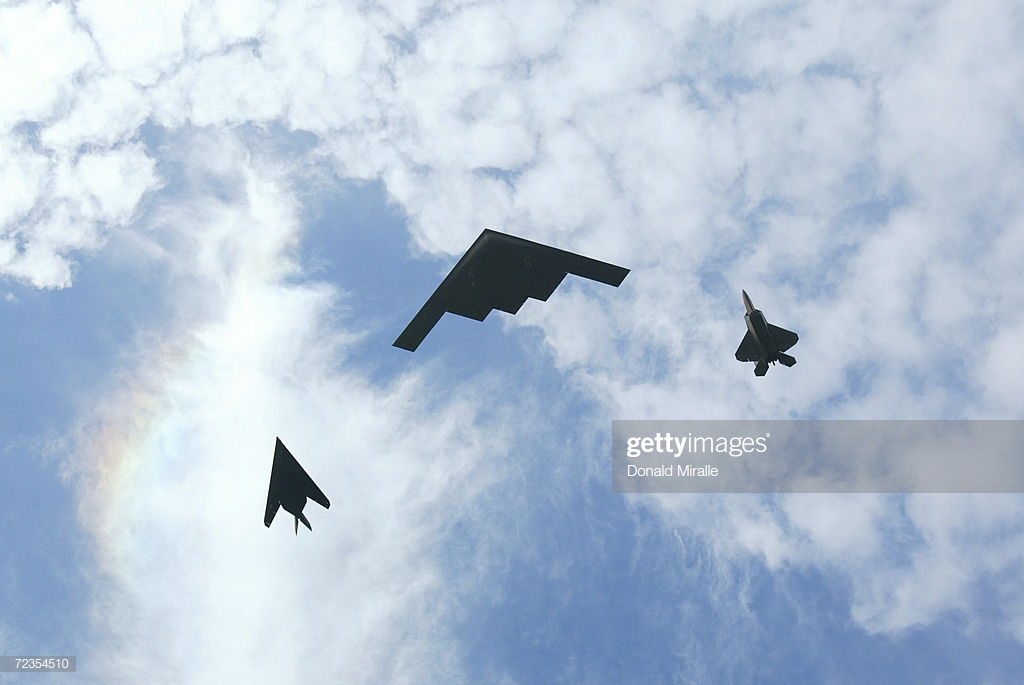 the-us-air-force-conducts-a-flyover-using-the-f22-rapture-b2-bomber-picture-id72354510