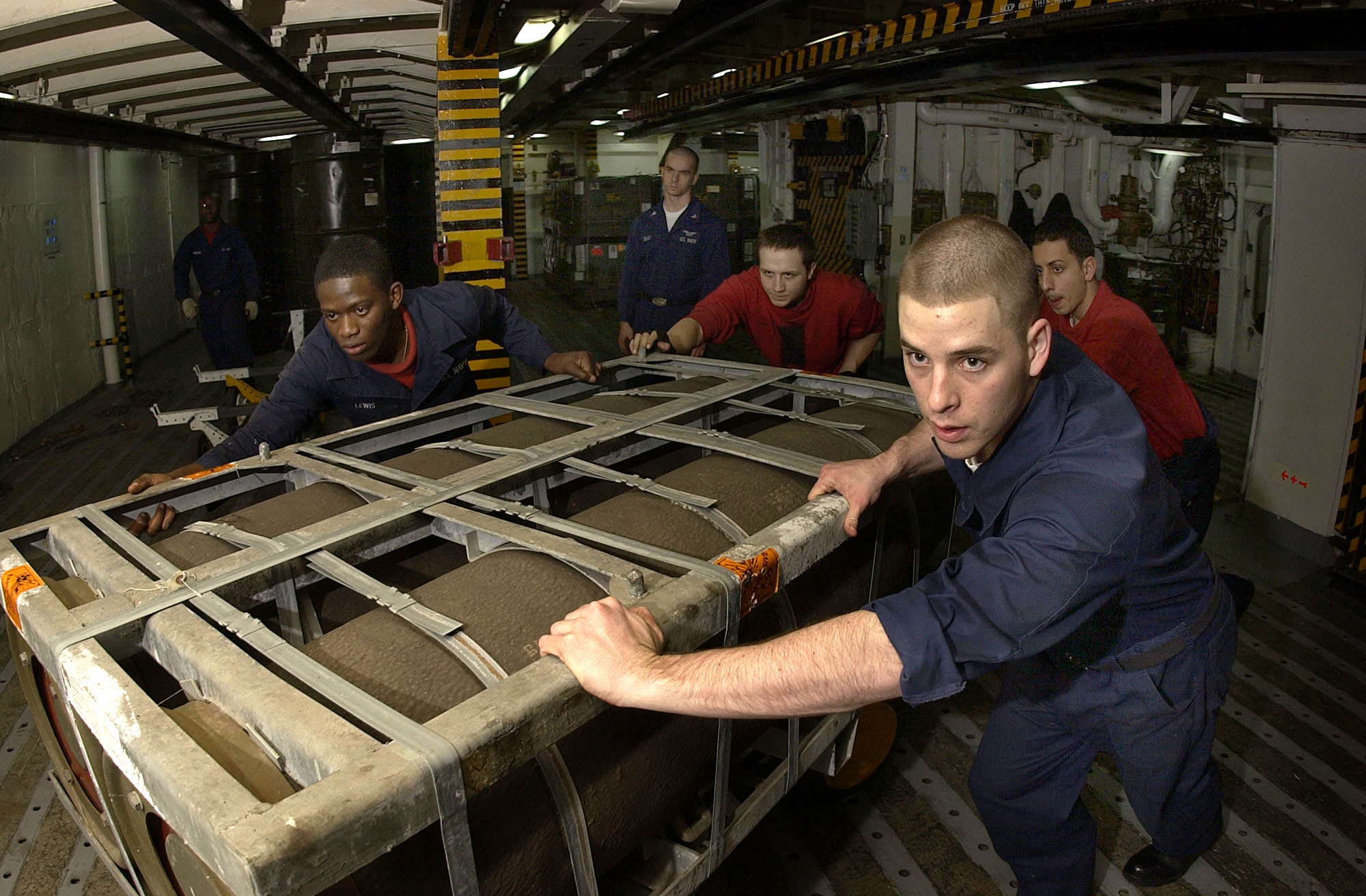US_Navy_050119-N-5464G-011_Sailors_assigned_to_the_Weapons_Department_aboard_USS_Kitty_Hawk_(CV_63),_move_a_palette_of_MK-84_2000_pound_general_purpose_bombs_into_a_magazine.jpg