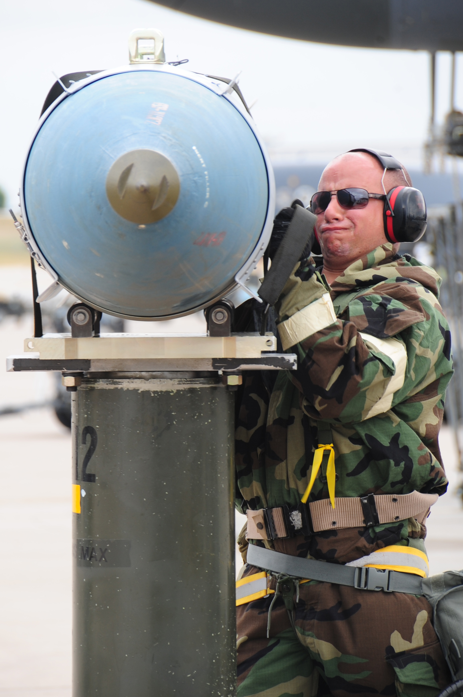 Defense.gov_News_Photo_100721-F-7939S-145_-_U.S._Air_Force_Airman_1st_Class_Jordan_Linial_a_weapons_technician_with_the_28th_Aircraft_Maintenance_Squadron_straps_a_GBU-31_guided_bomb_unit.jpg