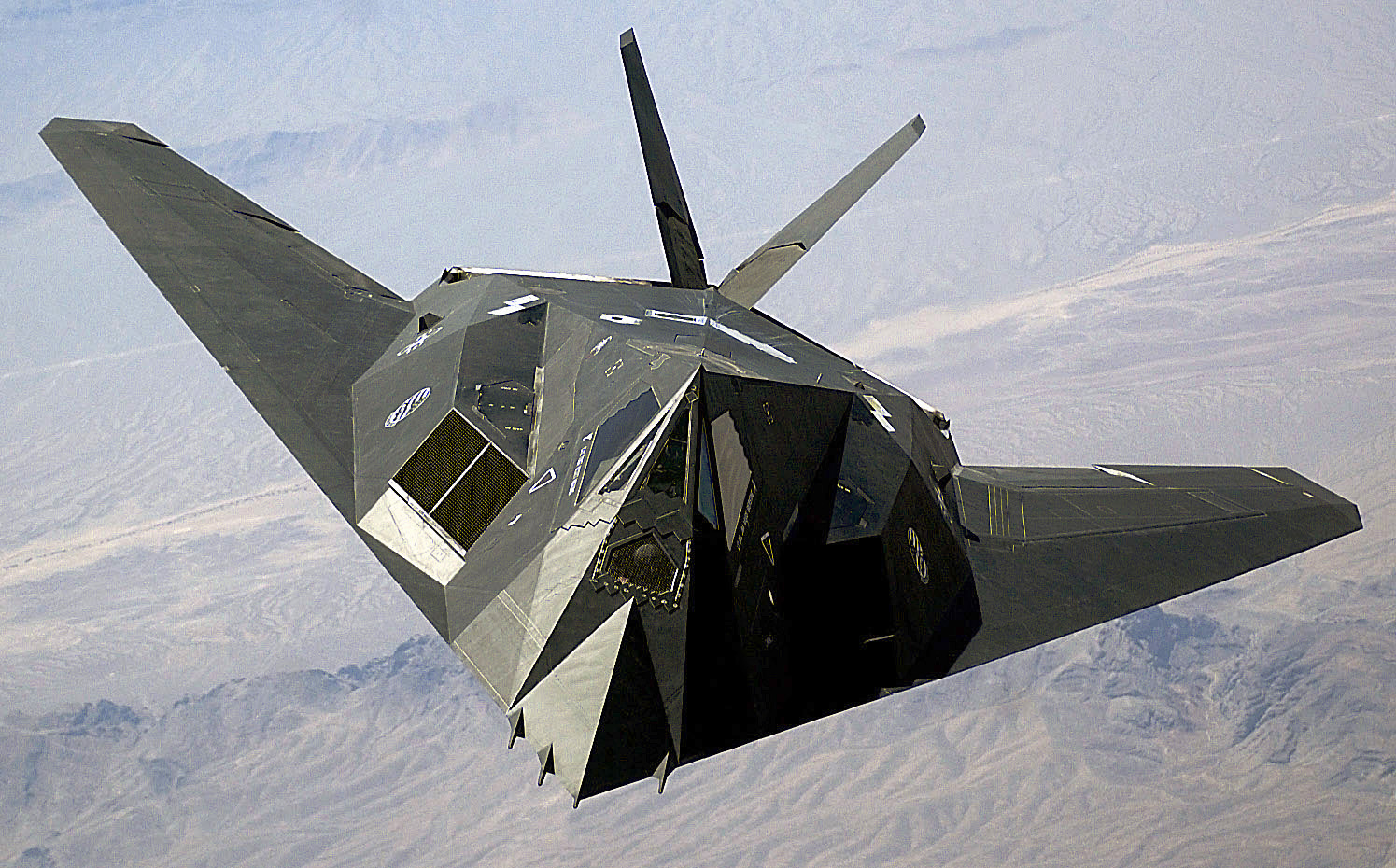 A-US-Air-Force-USAF-F-117A-Nighthawk-Stealth-Fighter-aircraft-flies-over-Nellis-Air-Force-Base-AFB-Nevada-NV.jpg