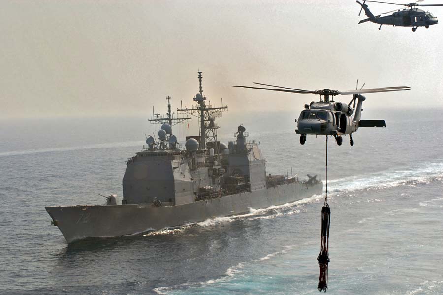 US_Navy_070414-N-3038W-333_Two_MH-60S_Seahawks,_from_the_Predators_of_Helicopter_Sea_Combat_Squadron_(HSC)_23,_fly_near_USS_Vella_Gulf_(CG_72).jpg