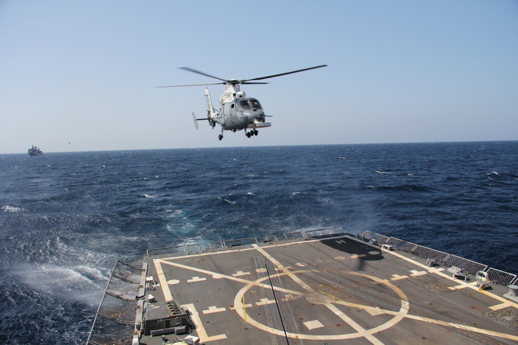 royal-saudi-naval-force-ship-hms-yanbus-helicopter-making-approach-over-the-flight-deck-of-uss-dewey-during-focused-operation-taawun-al-behr.jpg
