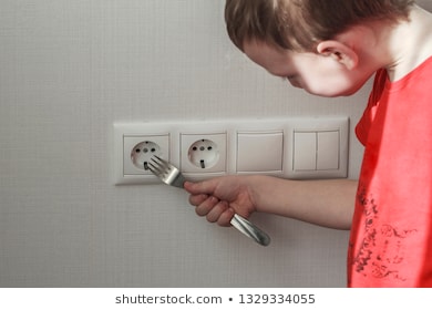 child-puts-plug-wall-outlet-260nw-1329334055.jpg