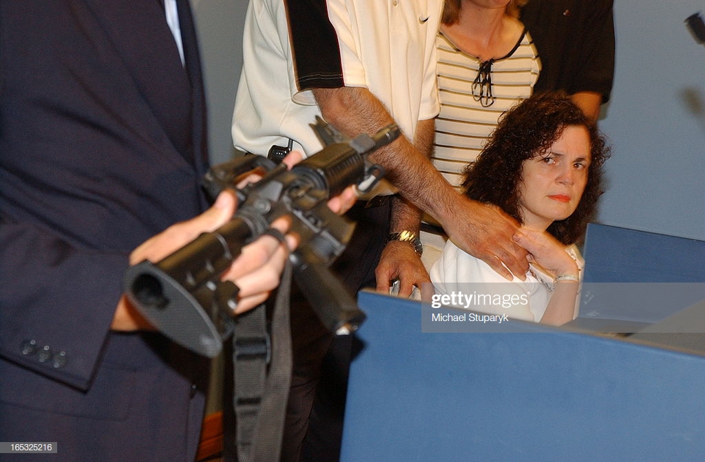 louise-russo-glances-at-a-colt-ar15-which-is-the-model-of-rifle-that-picture-id165325216