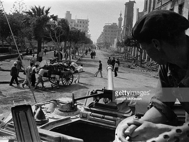 soldier-on-board-a-tank-looks-out-over-an-egyptian-street-during-the-picture-id2659257