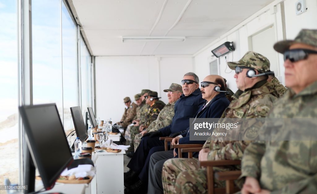 turkish-national-defense-minister-hulusi-akar-watches-the-winter-2019-picture-id1126480576