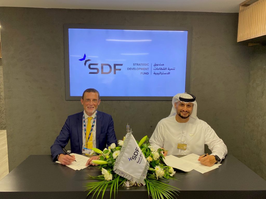 Mark Thomas and Abdulla Naser Al Jaabari signing agreement