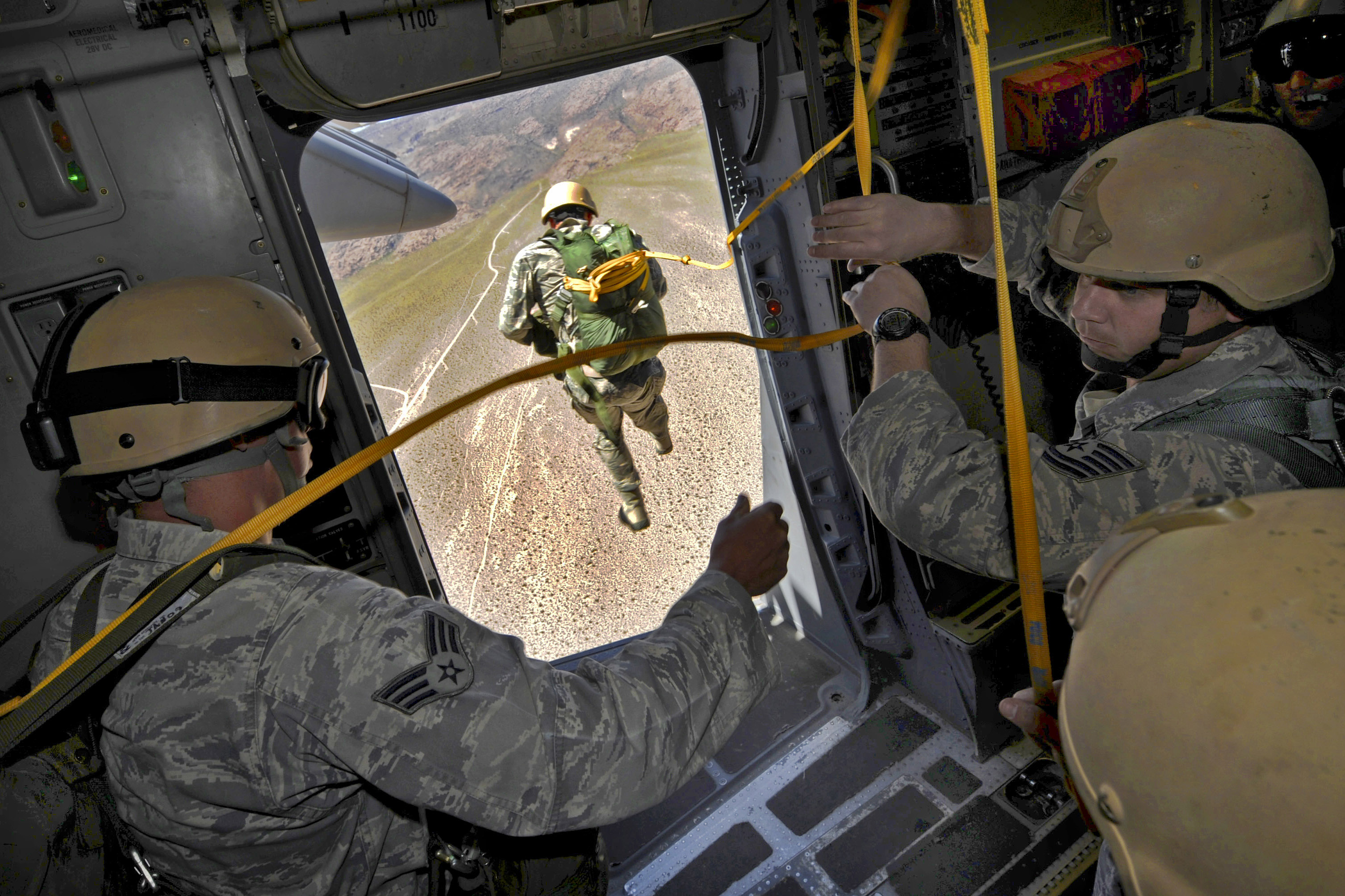 Defense.gov_News_Photo_110512-F-DP668-499_-_U.S._Air_Force_airmen_jump_from_a_C-17_Globemaster_III_aircraft_during_a_certification_course_for_drop_zone_control_officers_in_Alamo_Nev._on_May.jpg