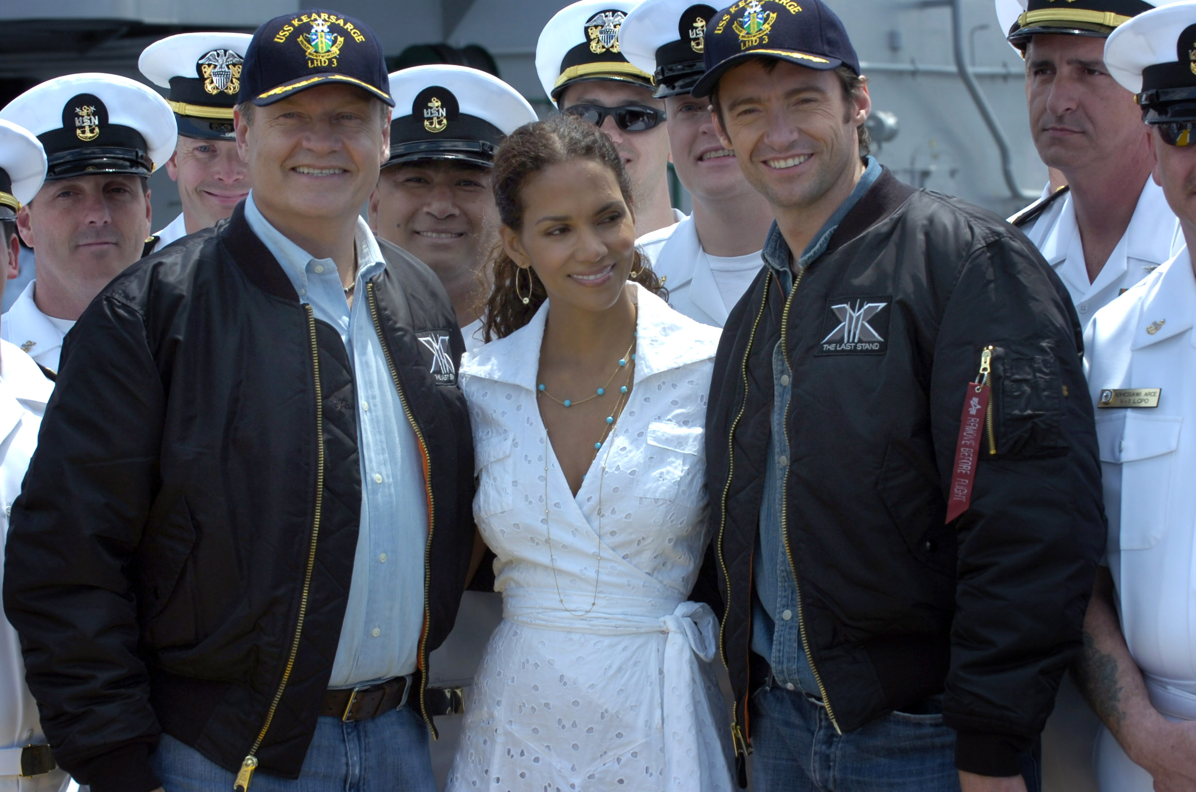 US_Navy_060524-N-7676W-279_Actors_Hugh_Jackman,_right,_AKA_Wolverine,_Ms._Halle_Berry,_center,_AKA_Storm,_and_Kelsey_Grammer,_left,_AKA_Dr._Henry_McCoy,_pose_for_pictures_with_crew_members.jpg
