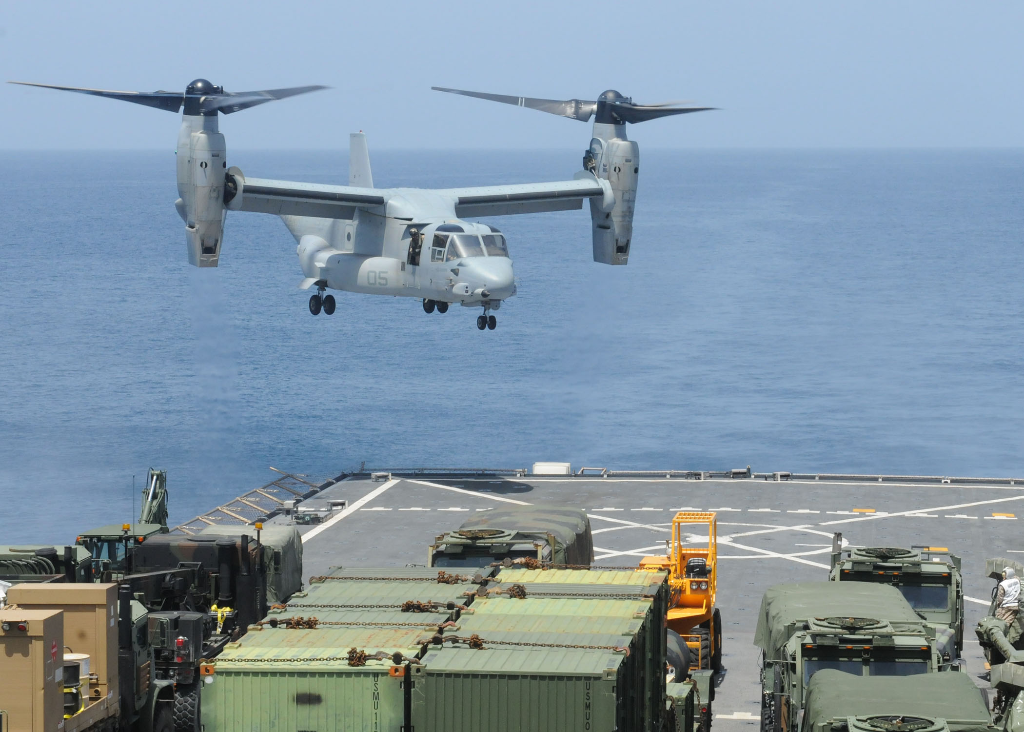 US_Navy_100716-N-8069G-231_A_Marine_Corps_V-22_Osprey_prepares_to_land_on_the_flight_deck_of_USS_Carter_Hall_(LSD_50).jpg