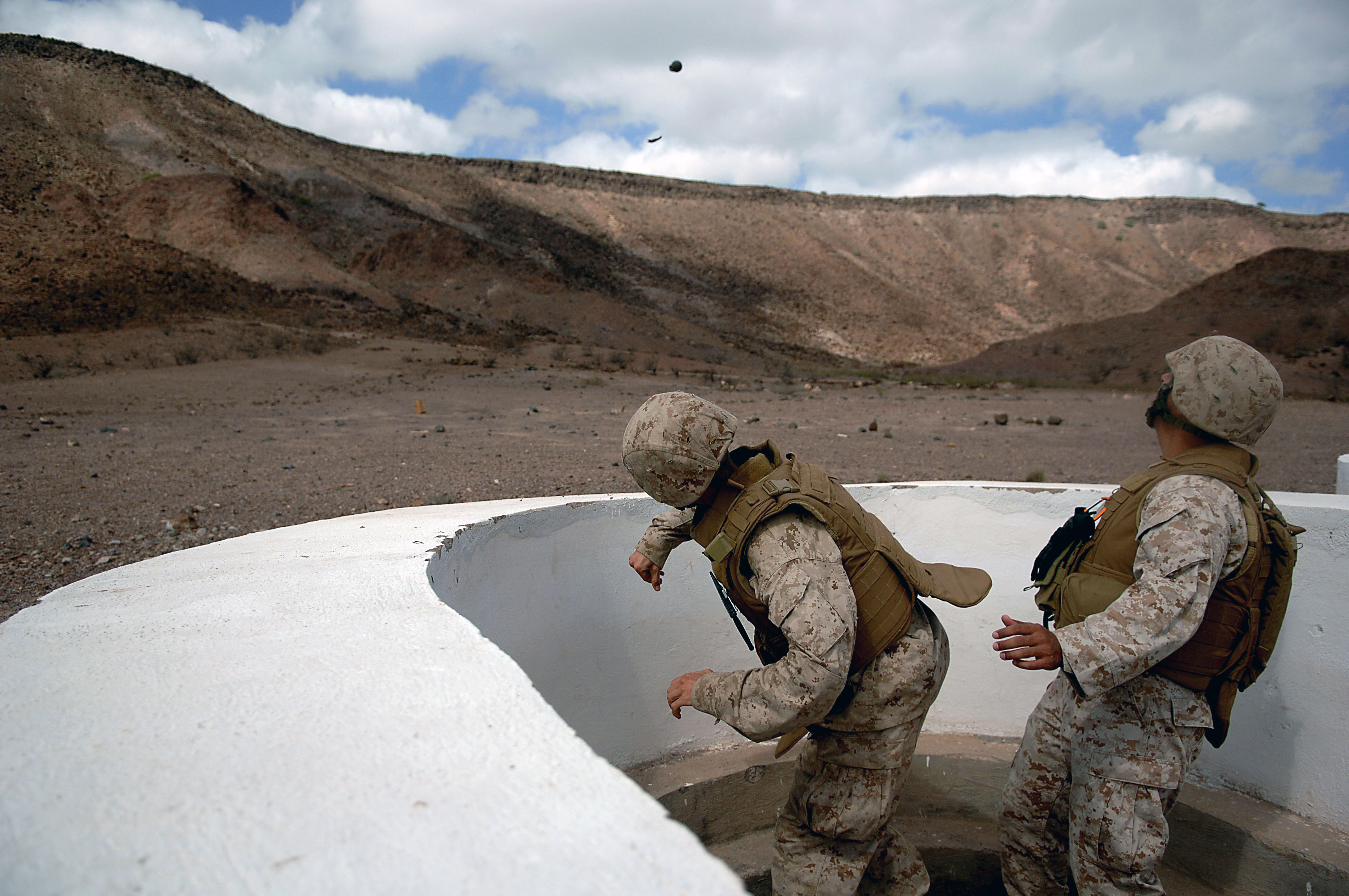 US_Navy_080123-F-1644L-044_A_Marine_assigned_to_the_3rd_Low_Altitude_Air_Defense_Battalion%2C_throws_a_M-67_Fragment_Grenade_at_the_firing_range.jpg