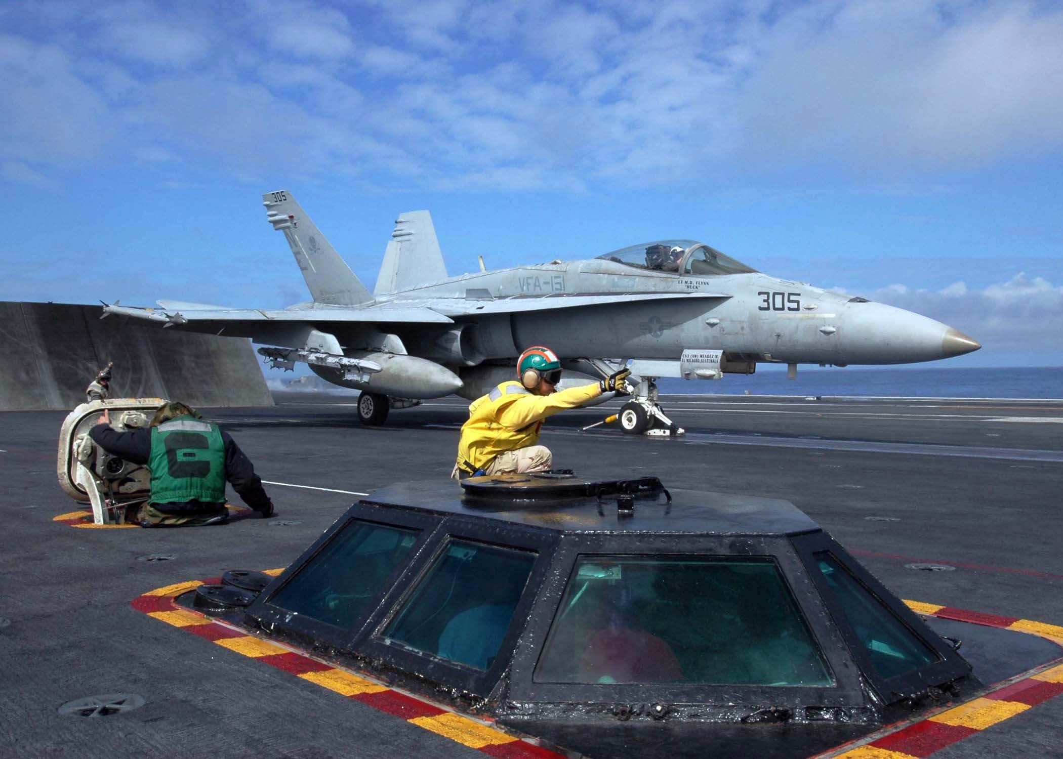 US_Navy_050228-N-1229B-052_A_catapult_shooter_signals_for_the_launch_of_an_F-A-18C_Hornet_on_the_flight_deck_aboard_the_Nimitz-class_aircraft_carrier_USS_Abraham_Lincoln_%28CVN_72%29.jpg
