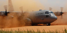 220px-C-130_Hercules_performs_a_tactical_landing_on_a_dirt_strip.jpg