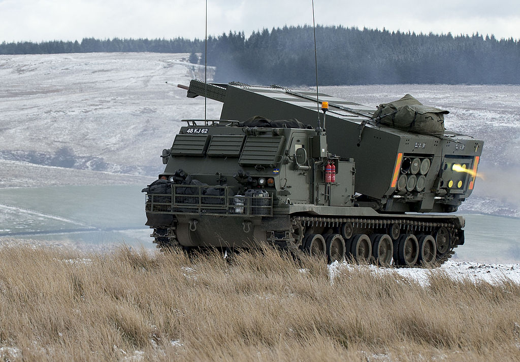 1024px-MLRS_firing_on_the_ranges_at_Otterburn._MOD_45158572.jpg