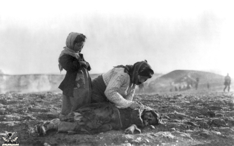 Armenian_woman_kneeling_beside_dead_child_in_field.png