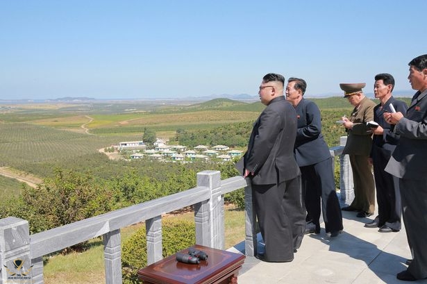 North-Korean-leader-Kim-Jong-Un-gives-field-guidance-during-a-visit-to-a-fruit-orchard-in-Kwai...jpg