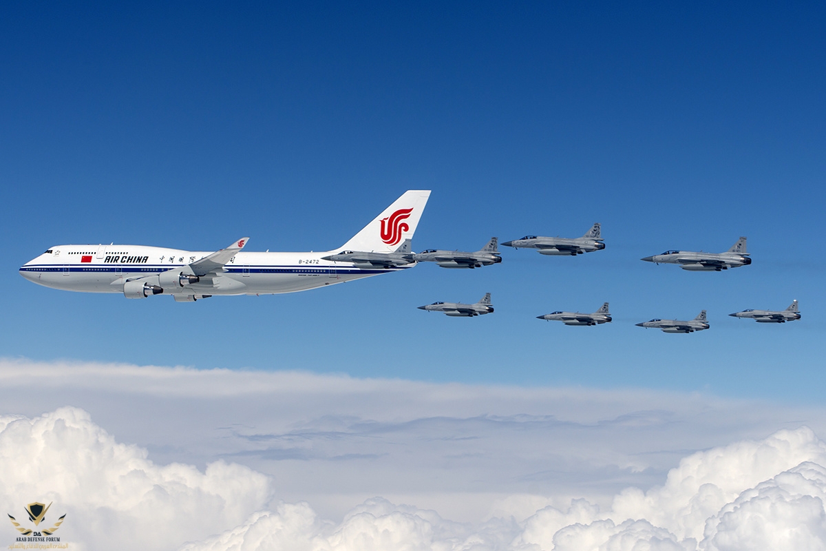 Eight_Pakistan_Air_Force_JF-17s_escort_Air_China_Boeing_747-400.jpg