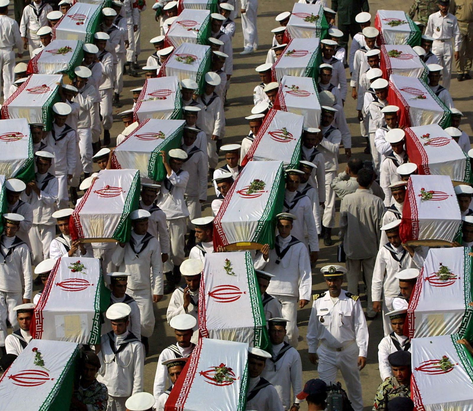 Iranian-sailors-carrying-the-coffins-containing-the-remains-of-Iranian-soldiers-killed-during-...jpg