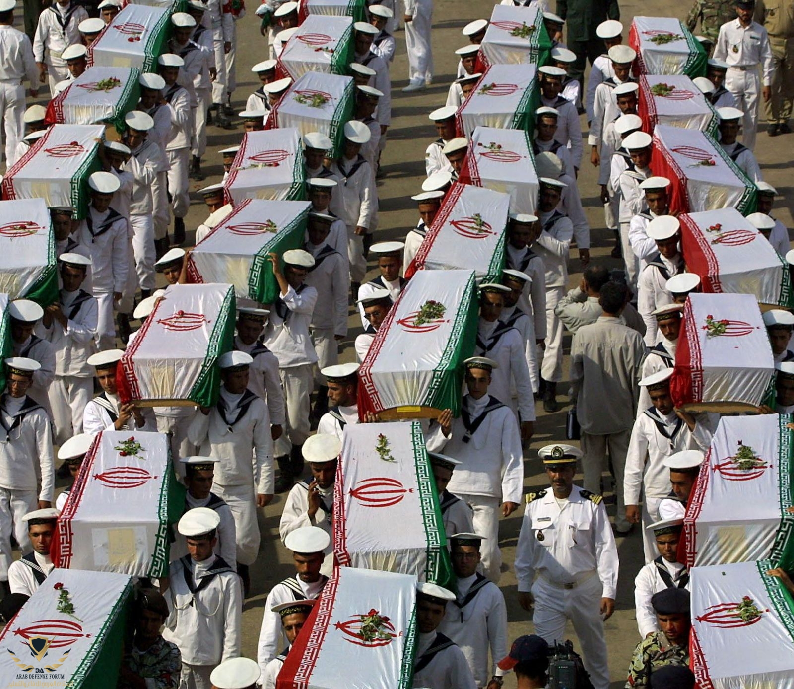 Iranian-sailors-carrying-the-coffins-containing-the-remains-of-Iranian-soldiers-killed-during-...jpg