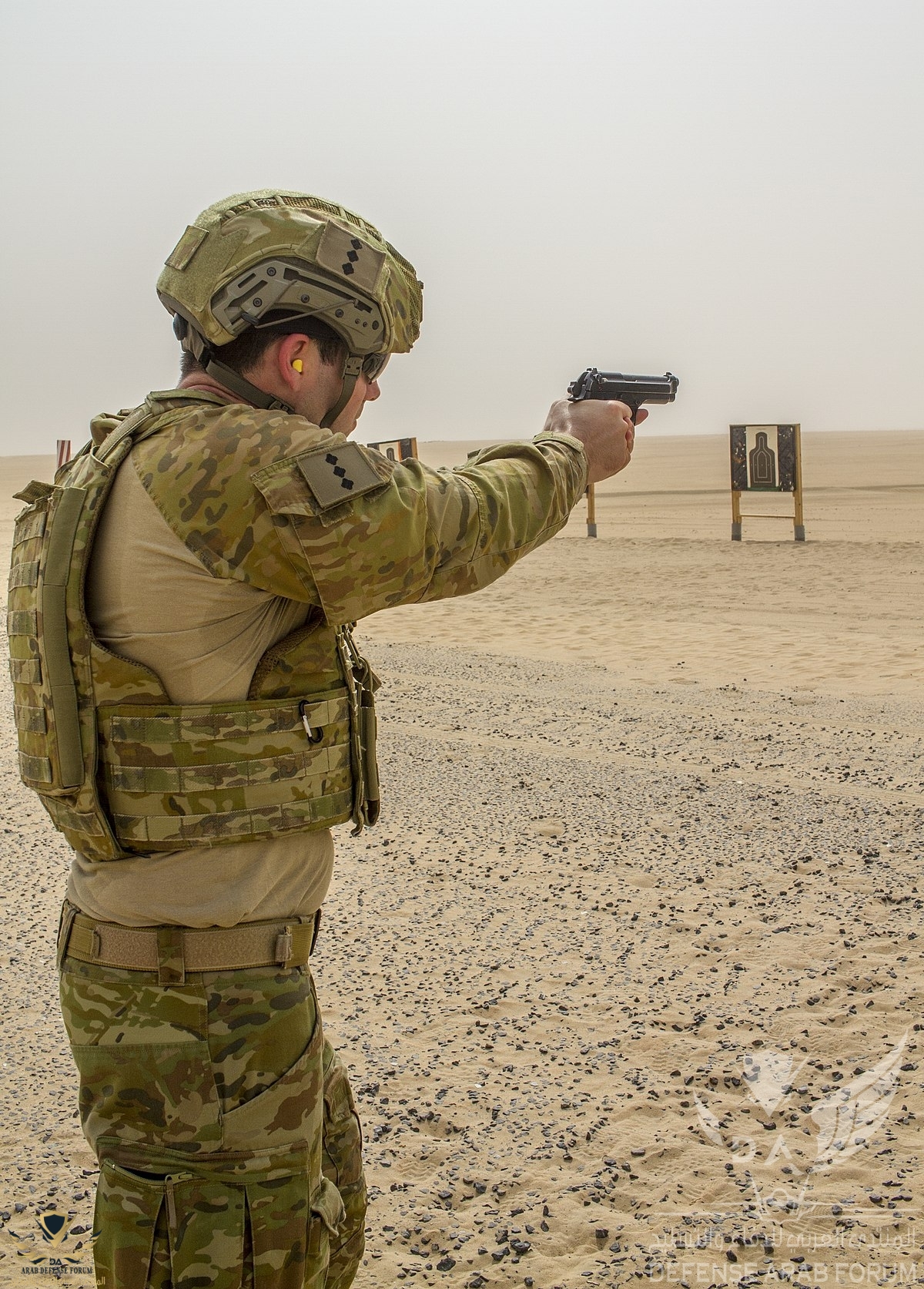 1200px-Australian_Army_officer_firing_a_M9_pistol_in_Kuwait_during_2018.jpg