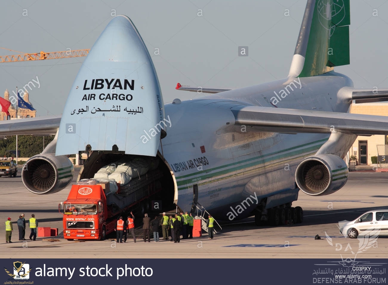 loading-cargo-on-board-a-libyan-air-cargo-antonov-an-124-by-reversing-C03PXY-1.jpg