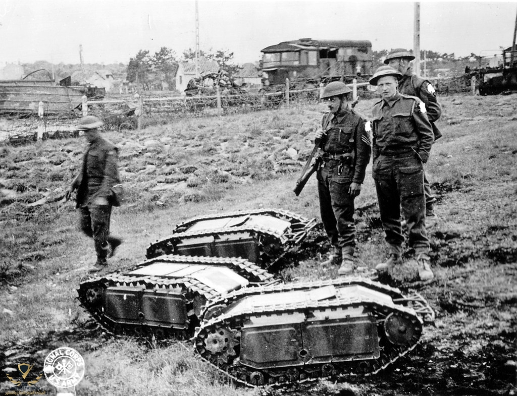 British-soldiers-with-captured-German-Goliath-tracked-mines.-1.jpg