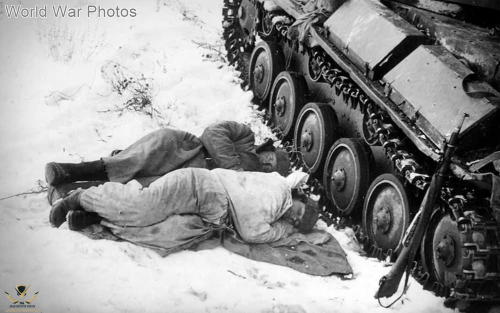 Tank_crew_sleep_near_their_T-70.jpg