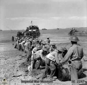 African-troops-bringing-supplies-ashore-on-Ramree-Island.jpg