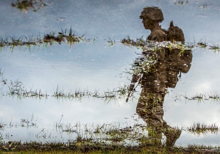 A U.S. Marine Corps recruit marches to his platoons next event during tactical training at the...jpg