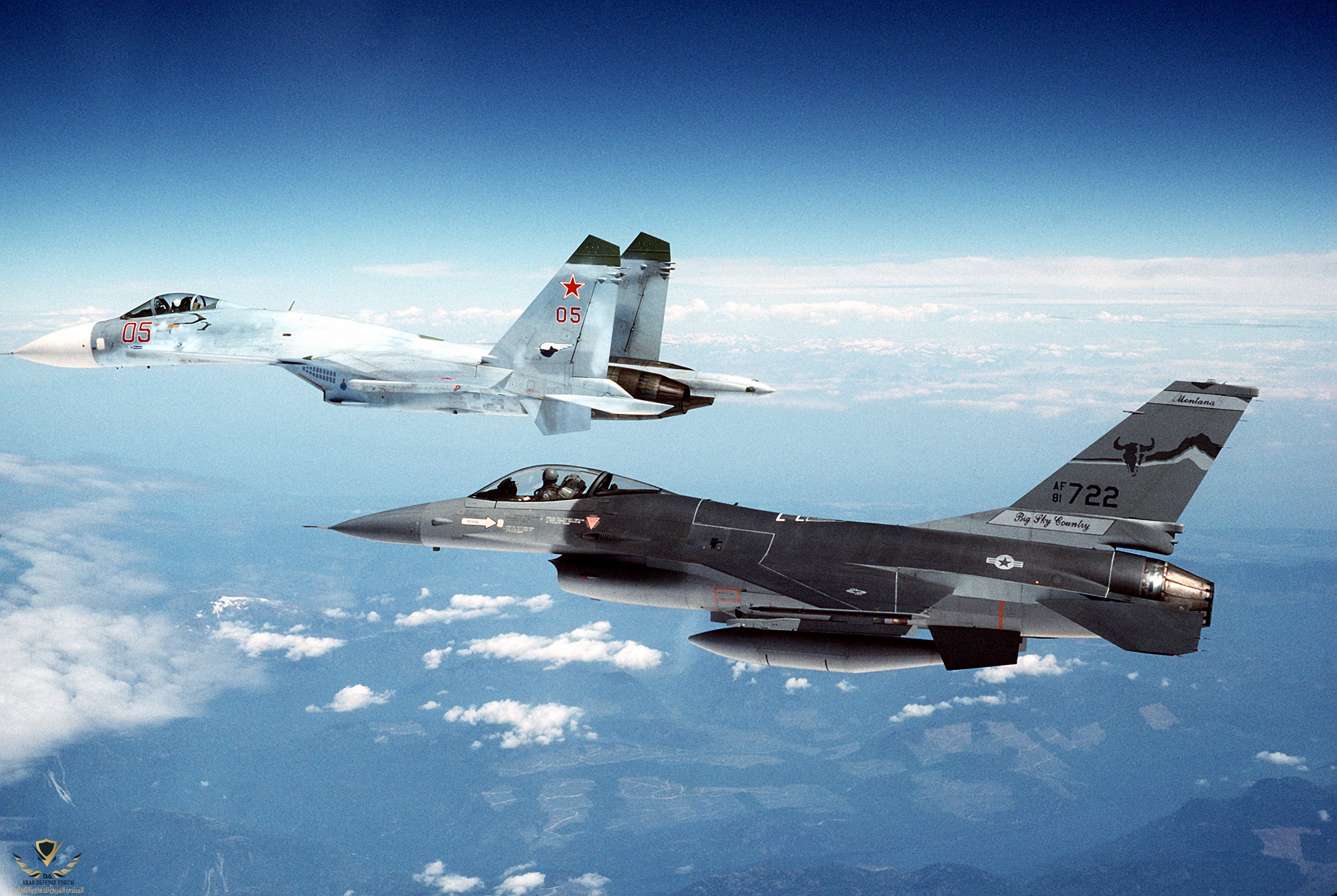 A Soviet Su-27 escorted by a United States Air Force F-16.jpg