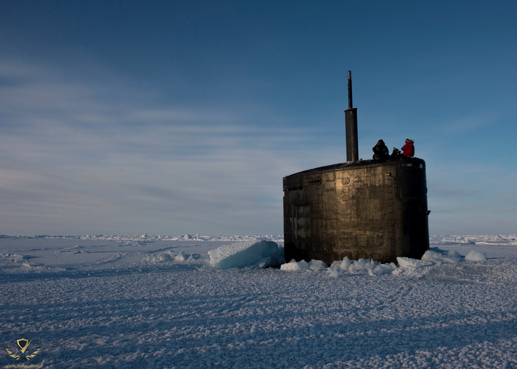 USS Hampton (SSN 767) surfaces through the ice in the Arctic Circle during.jpg