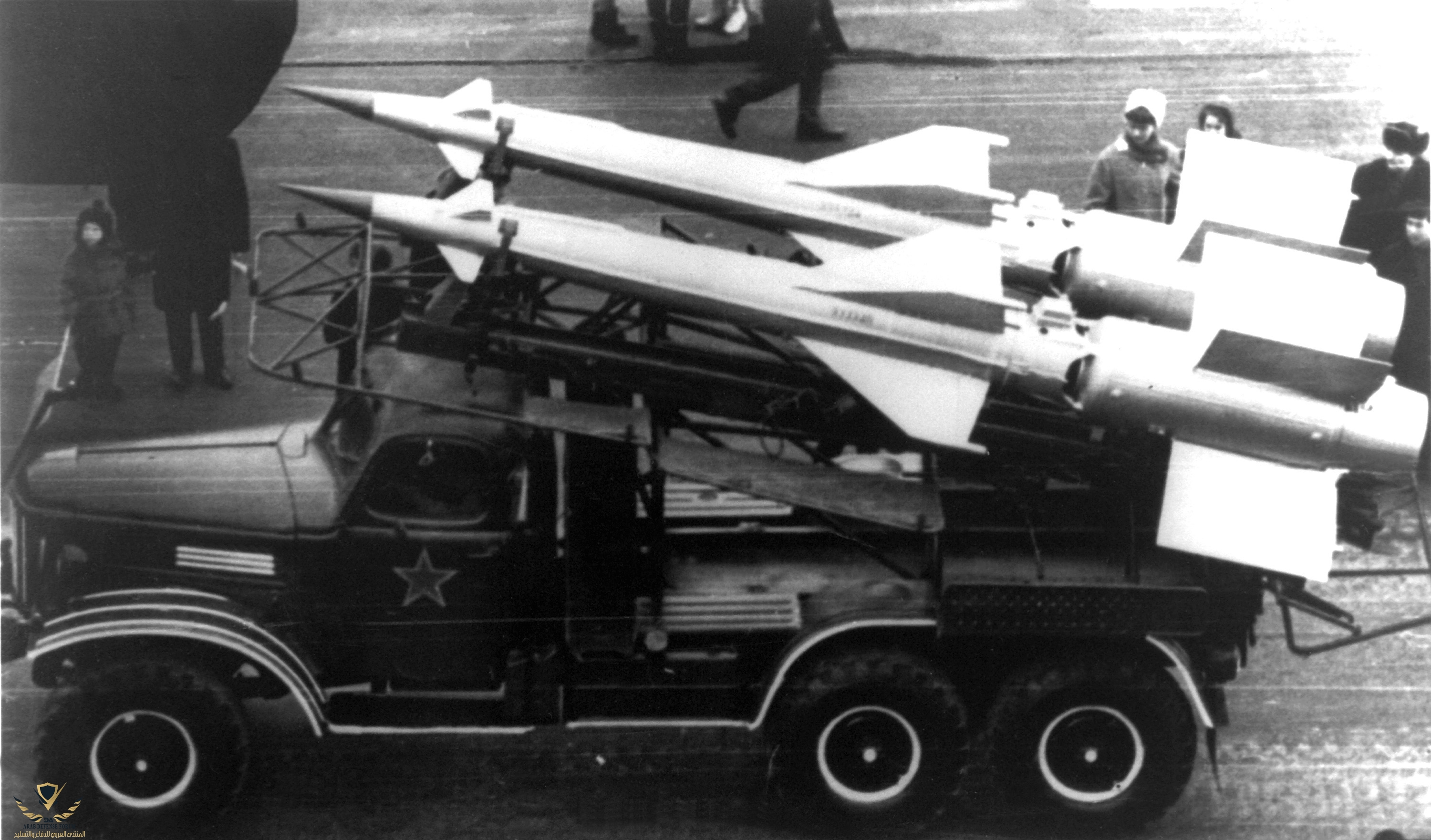 Pair_of_S-125_missiles_in_transit_on_a_truck.jpg