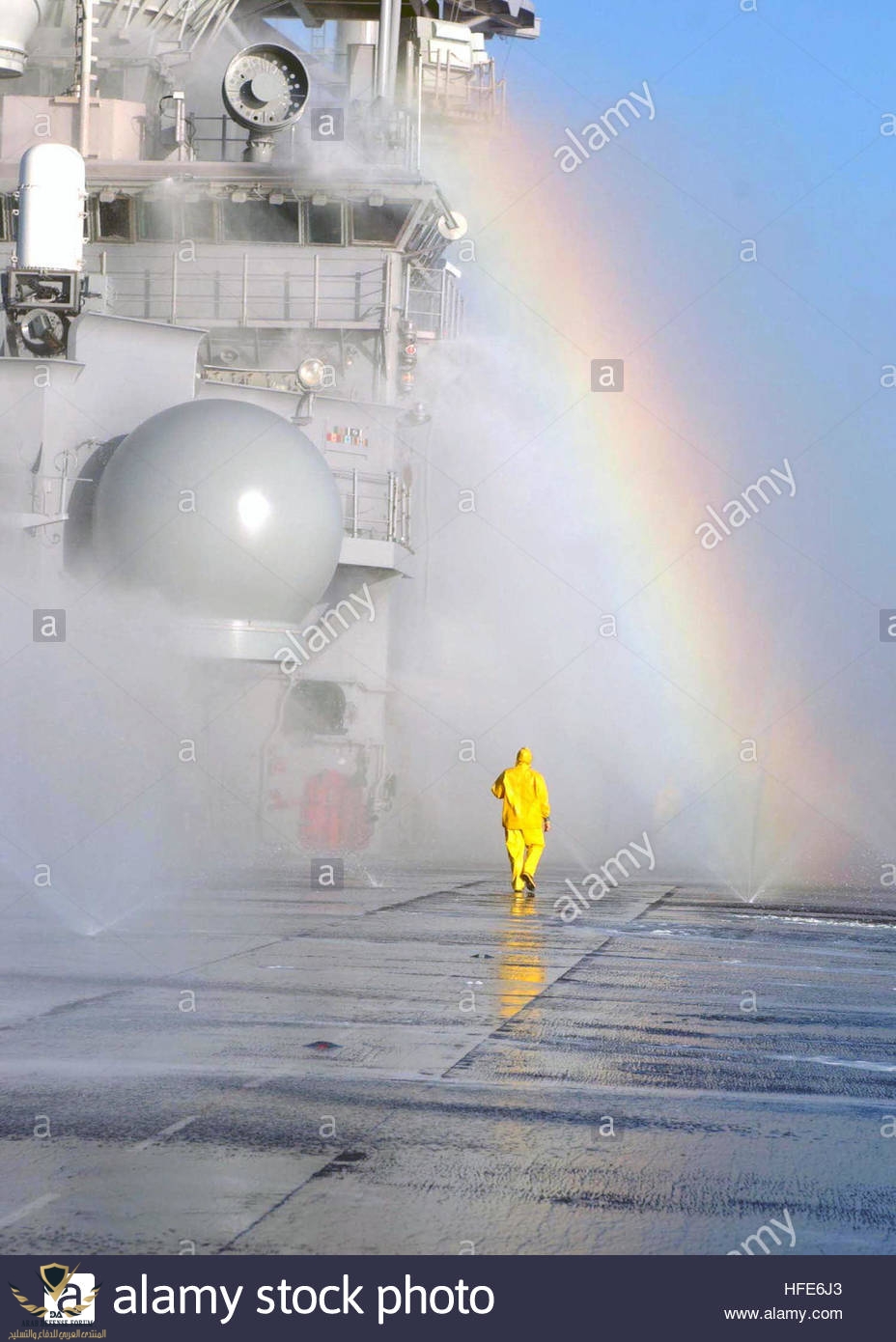 041206-n-3455p-008-pacific-ocean-dec-6-2004-a-rainbow-forms-as-a-sailor-HFE6J3.jpg