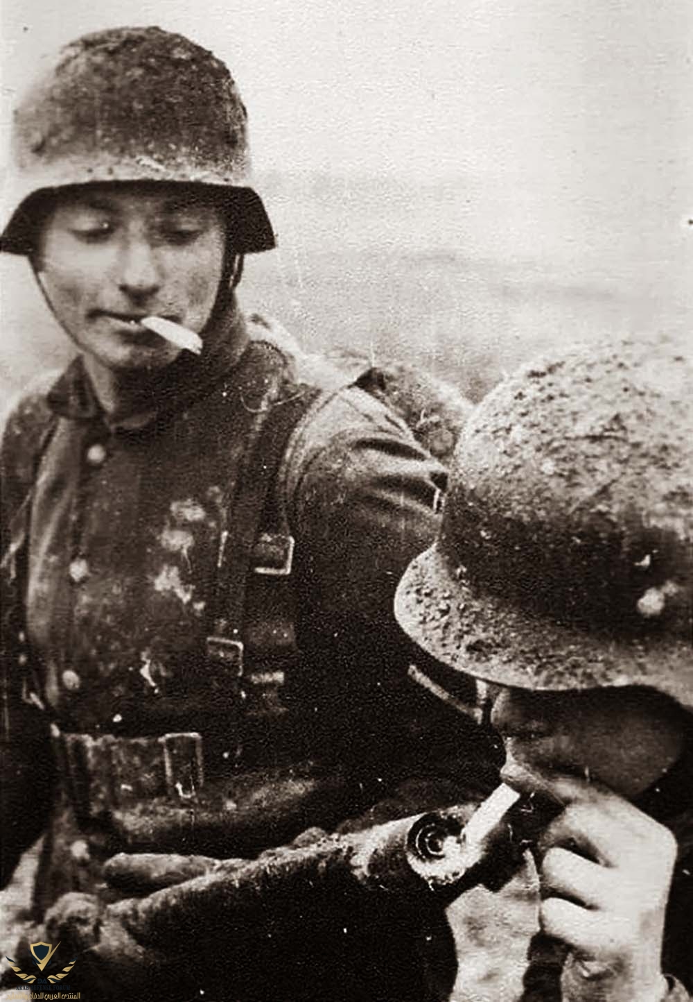 German soldier lighting his cigarette with a flamethrower, 1917.jpg