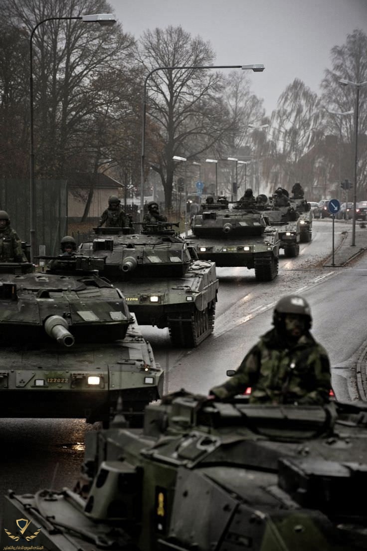 Swedish Leopard column moves through the town of Visby during an exercise on Gotland [736x1105].jpeg