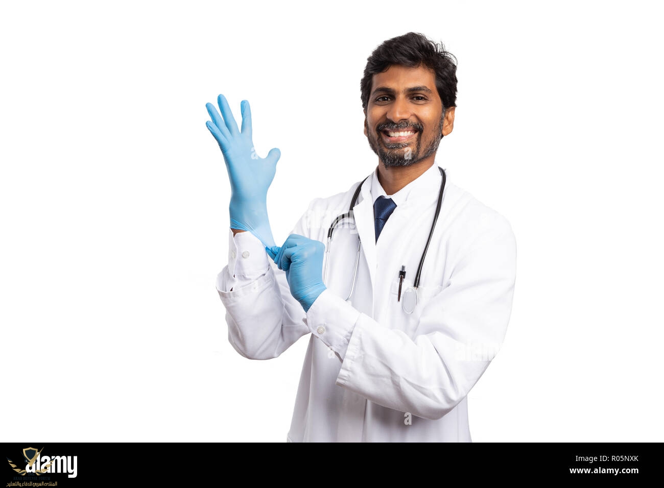 trustworthy-indian-medic-man-putting-on-blue-surgical-latex-glove-with-smile-as-hygiene-concep...jpg