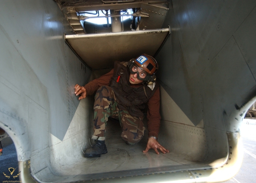 us_navy_040122-n-7090s-002_airman_bryan_lopezzaldival_from_long_beach_calif._inspects_the_inta...jpg