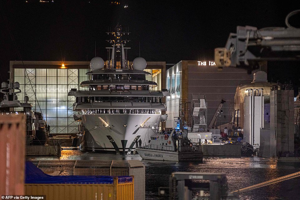 57508417-10794499-Italy_s_financial_police_patrol_boat_is_seen_in_front_of_the_mul-a-38_165201...jpg