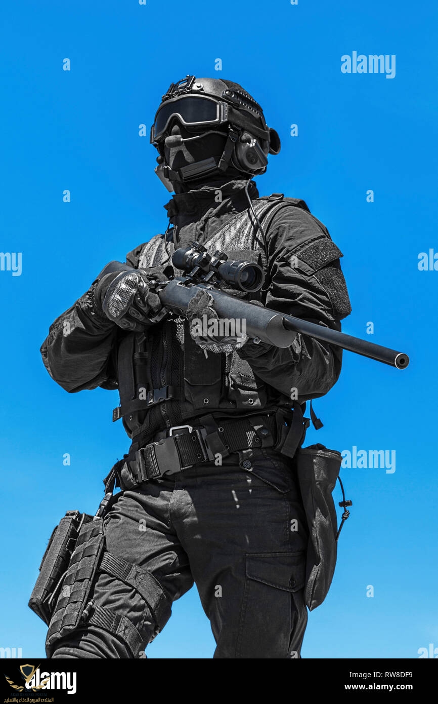 swat-police-operator-with-sniper-rifle-in-black-uniform-RW8DF9.jpg