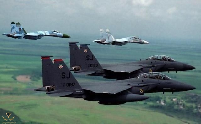 Su-30 and Su-27 and some F-15Es.jpeg