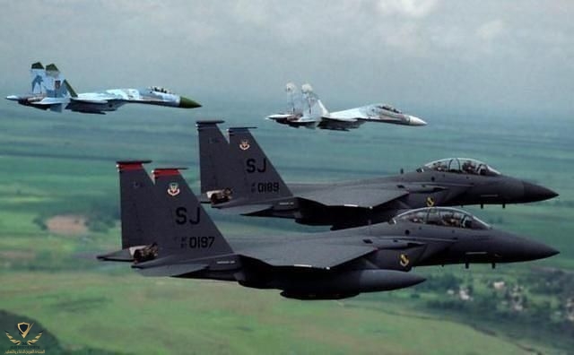 Su-30 and Su-27 and some F-15Es.jpeg