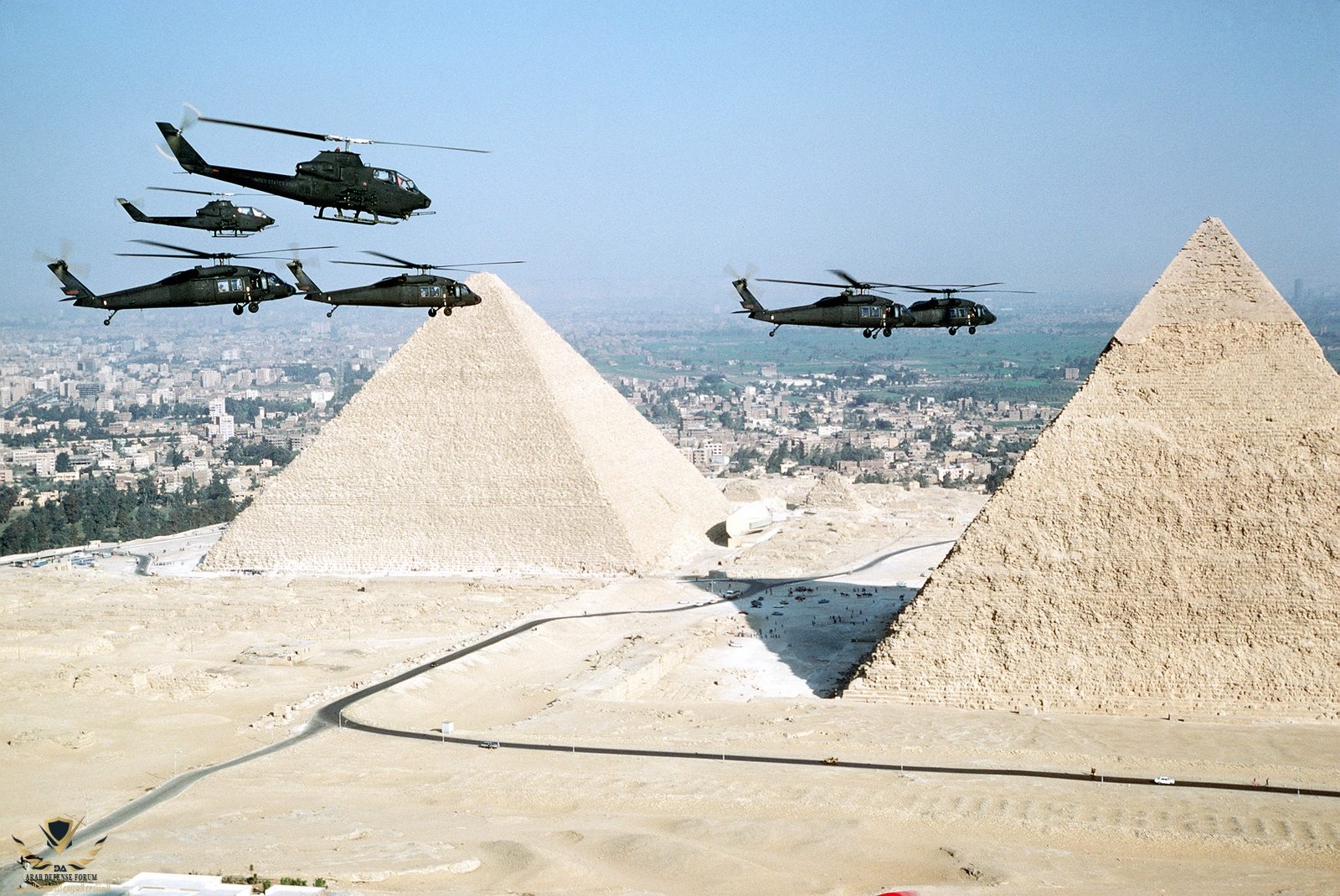an-air-to-air-right-side-view-of-uh-60-blackhawk-and-ah-1g-cobra-helicopters-f2cde6-1600.jpg