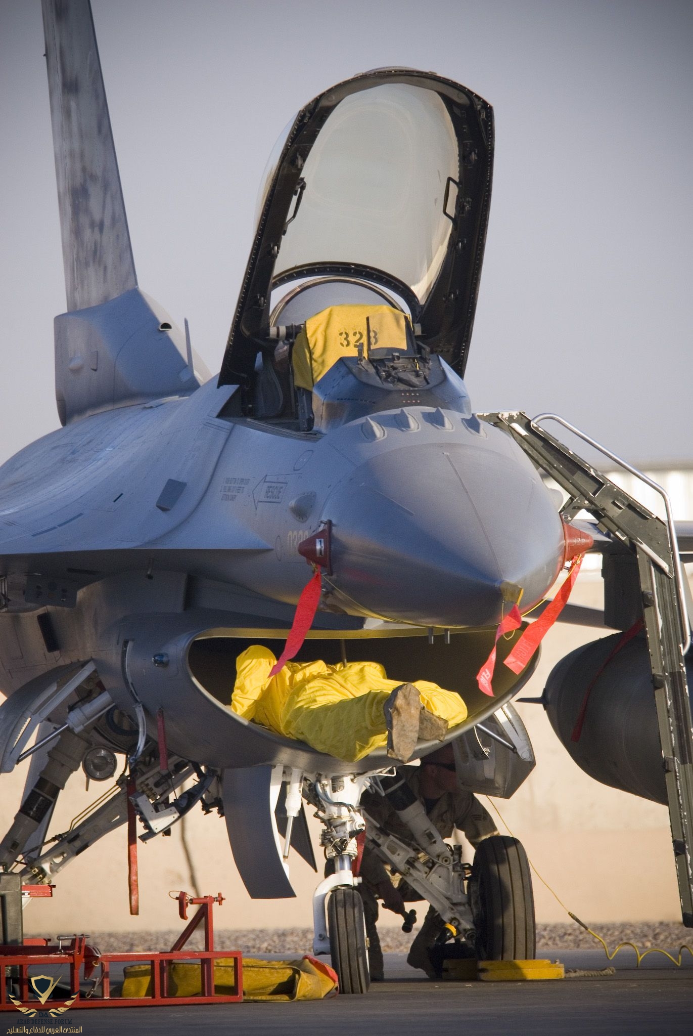 F-16CG CREW CHIEF INTAKE INSPECTION BEFORE ENGINE RUN.jpeg