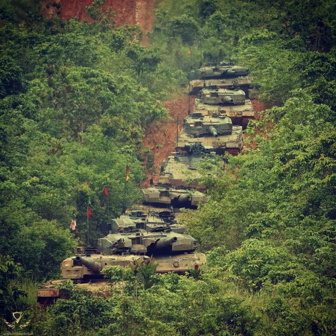 A column of Indonesian army Leopard 2A4 & 2RI MBT, and Marder 1A3 IFV during brigade-level in...jpeg
