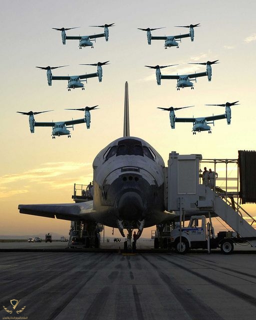 A group of MV-22 Osprey aircrafts fly over space shuttle after a successful shuttle mission.jpeg