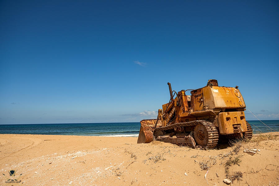 yellow-bulldozer-on-the-beach-andrea-pol.jpg