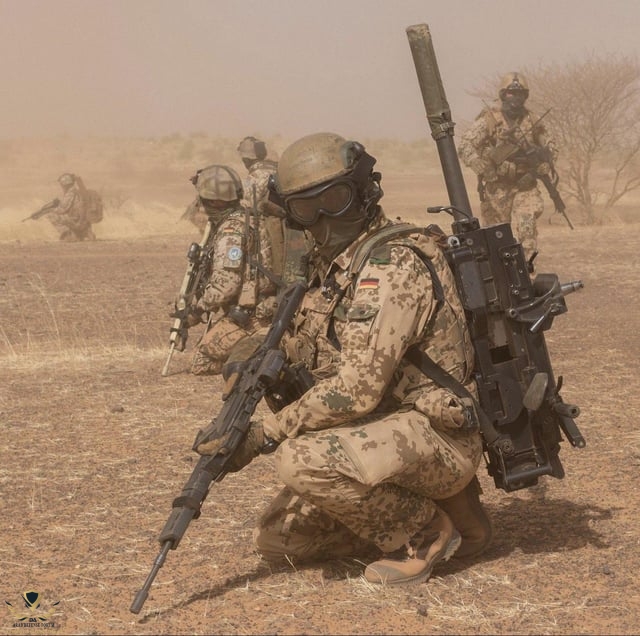 german-soldier-with-an-h-k-40mm-grenade-machine-gun-v0-w0ajhwmnlrla1.jpg
